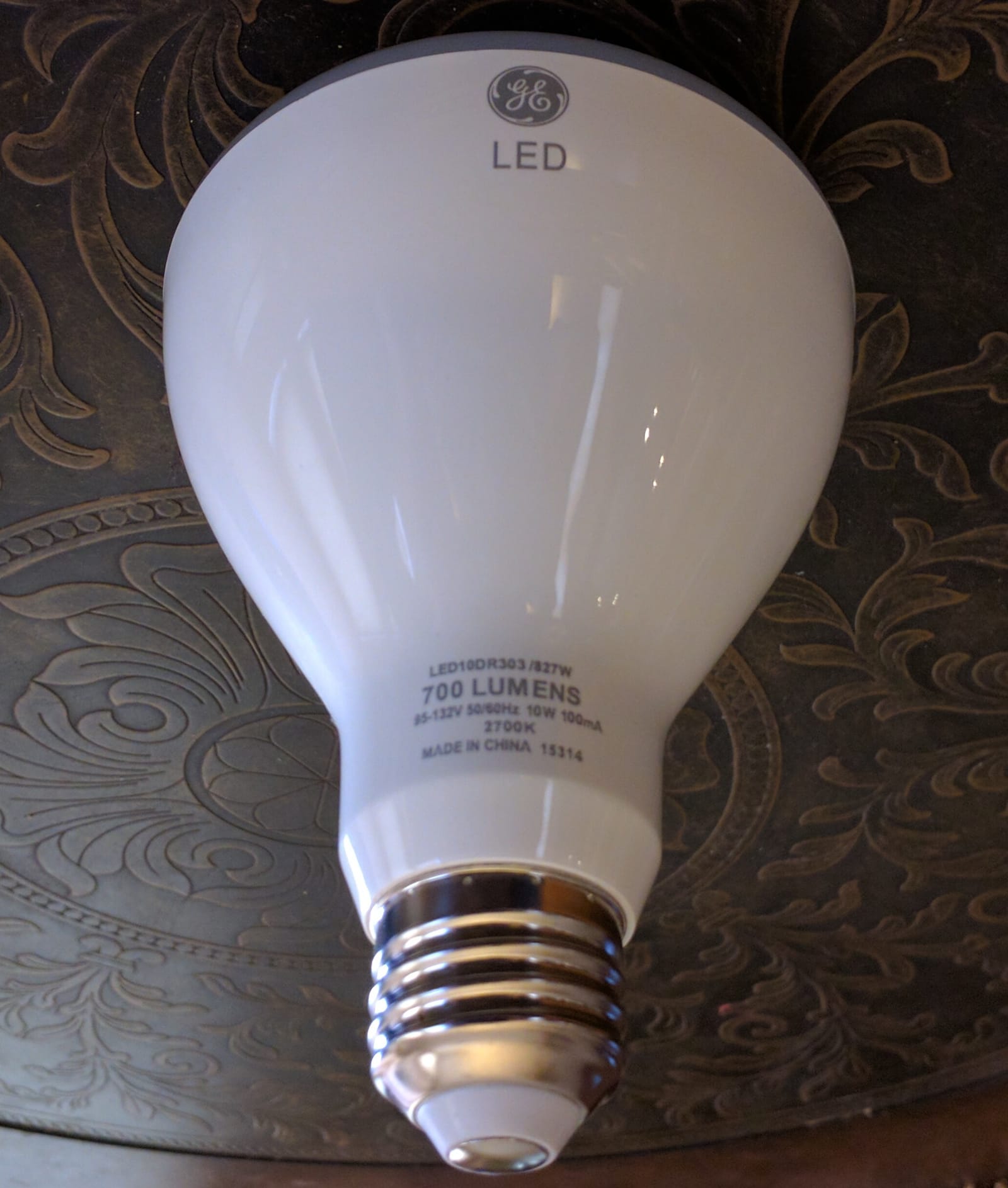 Close-up of a GE LED BR30 light bulb showing its 700-lumen, 2700K label
